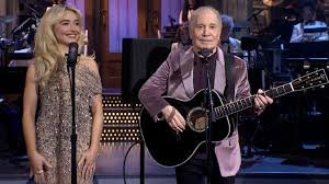 Paul Simon and Sabrina Carpenter commence the 50th anniversary celebration of 'SNL' with a duet performance.